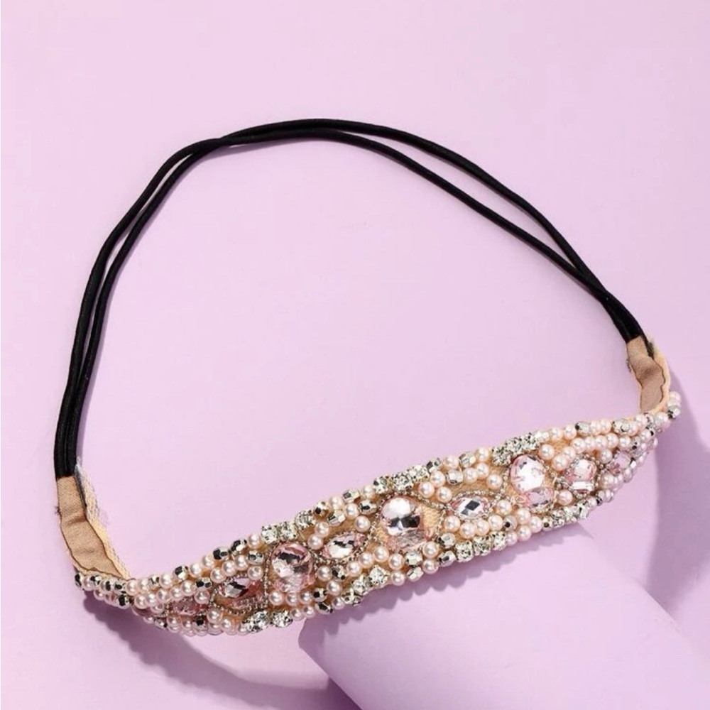 Bran new headband sling .Black sling with clear stones.